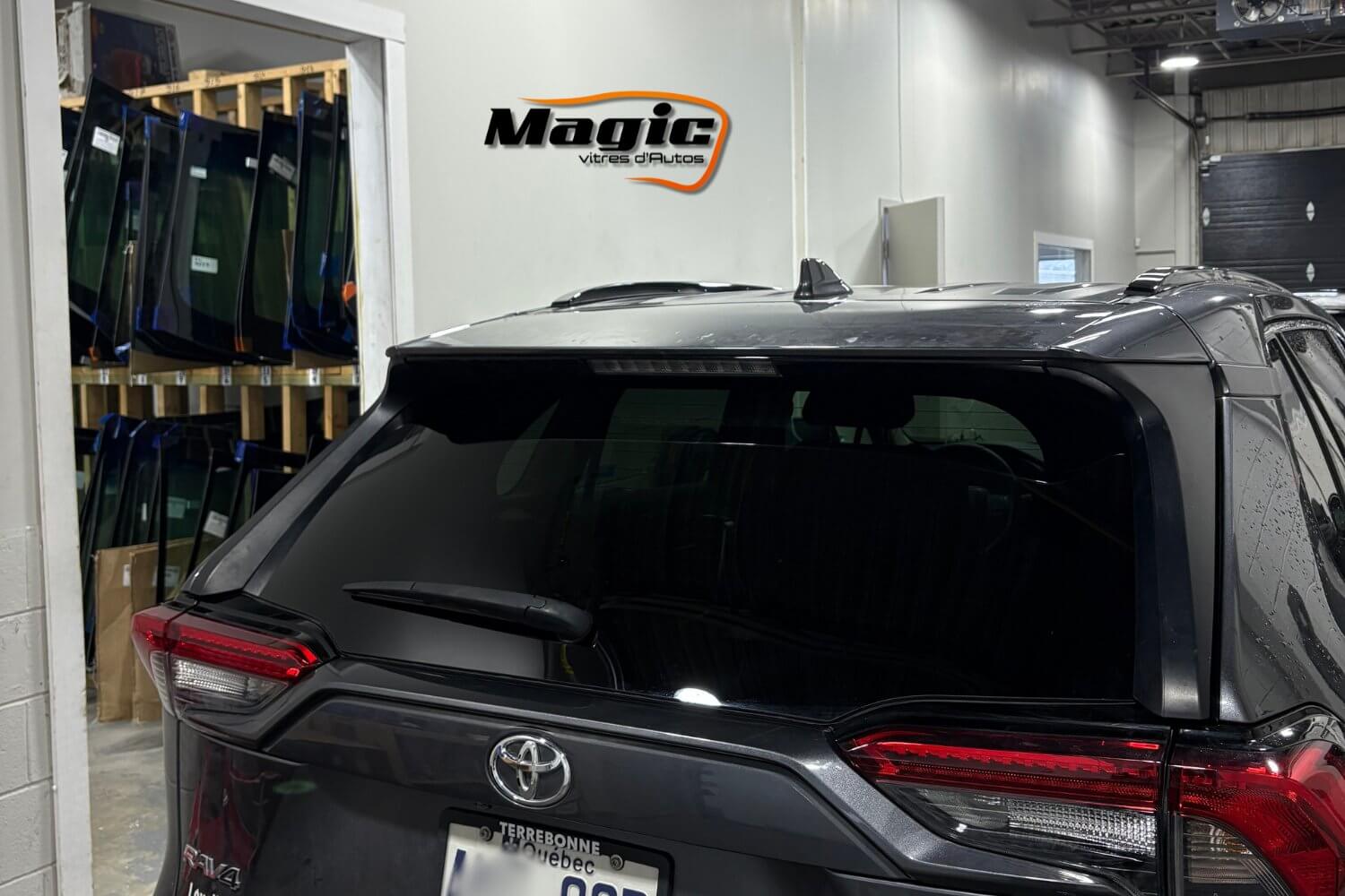 Rear window auto glass replacement on vehicle in DDO